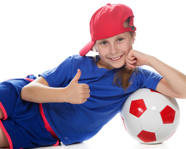 50265337 - beautiful girl in a sports cap and a t-shirt with a ball on a white background.
