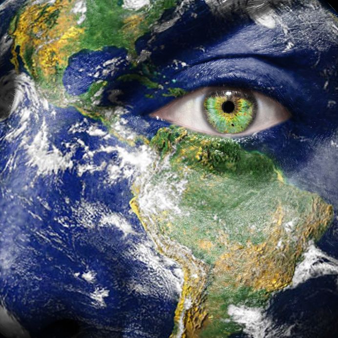 14386007 - earth painted on face to create awareness for climate