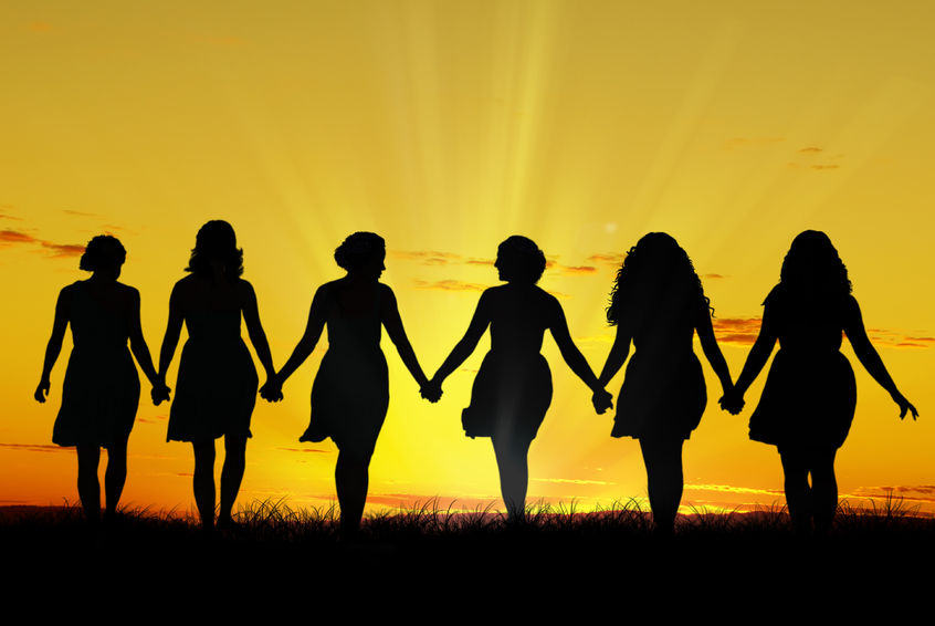 32755731 - silhouette of six young women, walking hand in hand